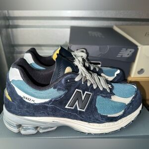 New Balance 2002R Protection Pack Dark Navy Men’s 10/ women’s 11.5